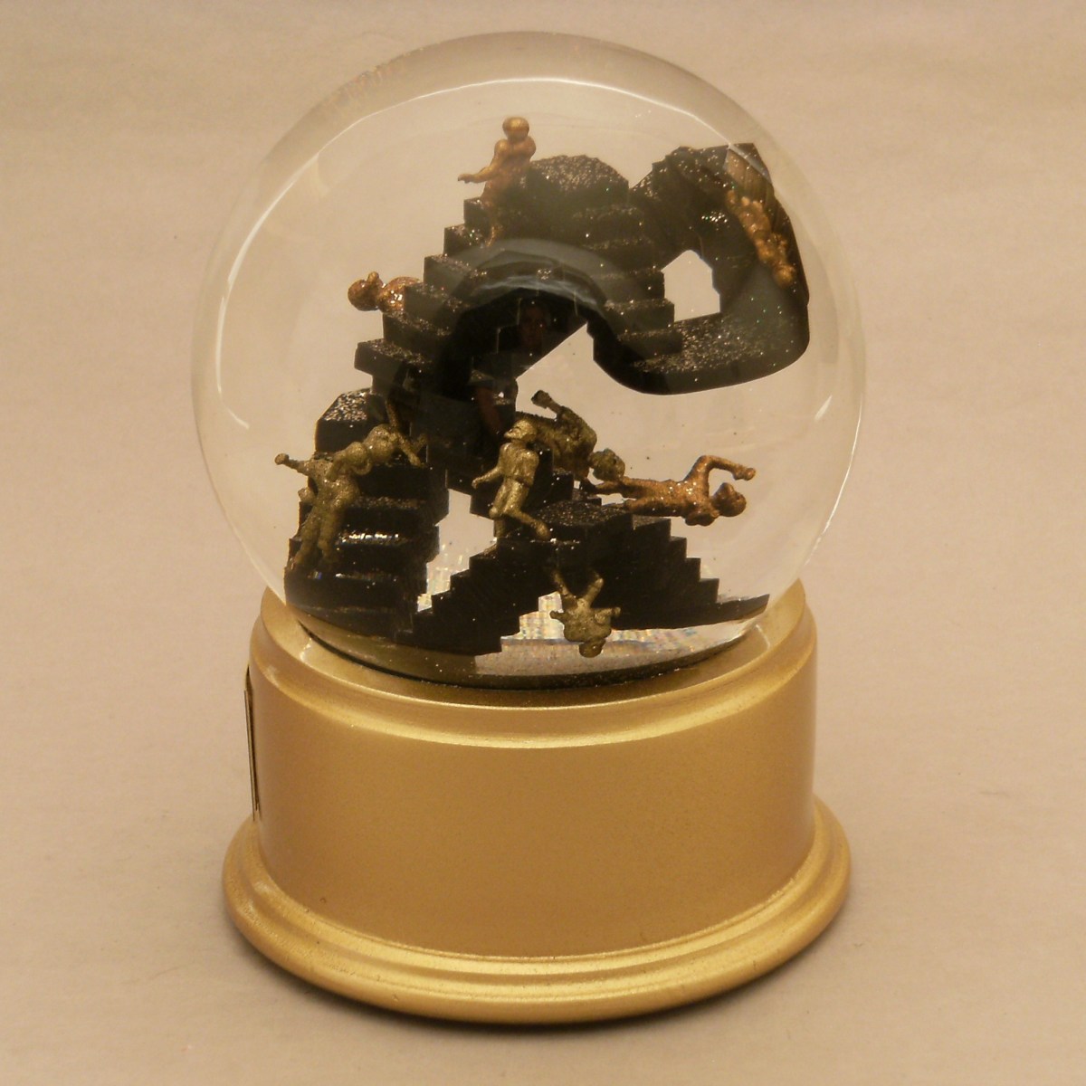 Escher football snow globe