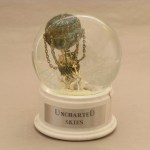 Uncharted Skies snow globe